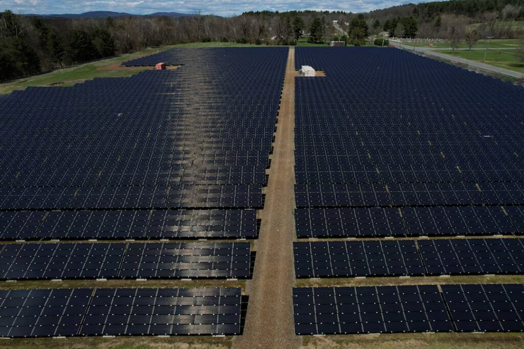 Source: Solar panels are arrayed on Earth Day in Northfield, Massachusetts, U.S., April 22, 2022. Picture taken with a drone. REUTERS, Brian Snyder